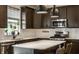 Stylish kitchen with stainless steel appliances, sleek countertops, and modern pendant lighting at 6767 Sonora Blvd, Brownsburg, IN 46112