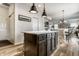 Open-concept kitchen boasts a center island and seamless transition to the living and dining areas at 6767 Sonora Blvd, Brownsburg, IN 46112