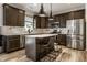Modern kitchen with stainless steel appliances, a large island, and ample cabinet space at 6767 Sonora Blvd, Brownsburg, IN 46112
