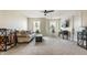 Bright living room featuring neutral walls, plush carpeting, and comfortable seating arrangement at 6767 Sonora Blvd, Brownsburg, IN 46112