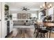Spacious living room with a comfortable sectional sofa, modern ceiling fan, and dining area at 6767 Sonora Blvd, Brownsburg, IN 46112