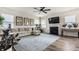 Bright living room with a fireplace, modern decor, neutral sectional, and luxury vinyl flooring at 6767 Sonora Blvd, Brownsburg, IN 46112