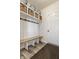 Mudroom boasts a built-in bench, coat hooks, and storage baskets for organization at 6767 Sonora Blvd, Brownsburg, IN 46112