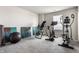 Bright workout room features an elliptical, exercise bike, inversion table, and balance ball at 6767 Sonora Blvd, Brownsburg, IN 46112