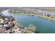 Wide aerial view of a community with lake, green spaces, and residential buildings at 7454 Harbour Isle # 158, Indianapolis, IN 46240