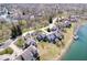 Overhead view of lakeside residences with scenic water views and mature trees at 7454 Harbour Isle # 158, Indianapolis, IN 46240