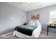 Neutral bedroom with a comfortable bed and natural light at 7454 Harbour Isle # 158, Indianapolis, IN 46240