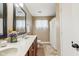 Bathroom featuring a dual sink vanity, bright lighting, and shower with curtain at 7974 N 500 W, McCordsville, IN 46055
