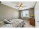 Bedroom featuring a ceiling fan, view to yard, and neutral paint at 7974 N 500 W, McCordsville, IN 46055