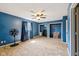 Bright bedroom with ceiling fan, blue walls, and window with natural light at 7974 N 500 W, McCordsville, IN 46055