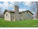 Charming stone home with well-maintained lawn and chimney at 7974 N 500 W, McCordsville, IN 46055