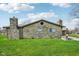 Charming stone house with well-maintained lawn and chimney at 7974 N 500 W, McCordsville, IN 46055