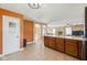 Open-concept kitchen with island and view into a carpeted living room at 7974 N 500 W, McCordsville, IN 46055