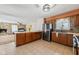 Updated kitchen with stainless steel appliances, and earth-toned backsplash, and tiled floor at 7974 N 500 W, McCordsville, IN 46055