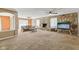 Cozy living room featuring stone fireplace, neutral tones, and plush carpeting at 7974 N 500 W, McCordsville, IN 46055