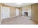 Cozy living room with a stone fireplace, neutral carpet, and white paneled doors at 7974 N 500 W, McCordsville, IN 46055