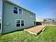 A wooden deck attached to the house overlooks a lawn, great for enjoying the outdoors at 8051 Retreat Ln, Indianapolis, IN 46259
