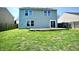 The backyard is spacious and the home offers a wood deck at 8051 Retreat Ln, Indianapolis, IN 46259