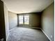 This bedroom features neutral paint, plush gray carpet and a pair of windows at 8051 Retreat Ln, Indianapolis, IN 46259
