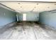 Spacious garage with concrete floor, offering ample parking and storage space at 8051 Retreat Ln, Indianapolis, IN 46259