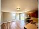 Bright eat-in kitchen featuring wood cabinets, neutral countertops, and modern appliances at 8051 Retreat Ln, Indianapolis, IN 46259