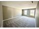 Inviting living room featuring neutral paint, plush carpet, and windows offering plenty of natural light at 8051 Retreat Ln, Indianapolis, IN 46259