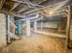 Unfinished basement with exposed pipes and cinder block walls at 831 Wallace Ave, Indianapolis, IN 46201