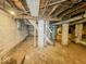Unfinished basement with exposed pipes and cinder block walls at 831 Wallace Ave, Indianapolis, IN 46201