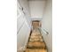 View down the wooden basement stairs at 831 Wallace Ave, Indianapolis, IN 46201