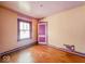 Bedroom showcasing hardwood floors, vintage trim and window at 831 Wallace Ave, Indianapolis, IN 46201