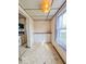 Dining room with window, built-in storage, and access to adjacent kitchen at 831 Wallace Ave, Indianapolis, IN 46201