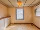 Cozy dining room featuring a vintage light fixture and a built-in storage area at 831 Wallace Ave, Indianapolis, IN 46201