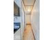 Hallway view into multiple rooms with vintage style flooring at 831 Wallace Ave, Indianapolis, IN 46201