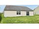 A view of the home's rear exterior, with a sliding glass door providing access to the backyard at 8660 Benjamin Ln, Avon, IN 46123