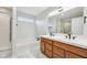 Bathroom features double sink vanity, soaking tub, and separate shower with tile floors at 8660 Benjamin Ln, Avon, IN 46123