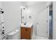 Modern bathroom featuring stylish vanity, sink, toilet, mirror, and elegant marble tile flooring at 8660 Benjamin Ln, Avon, IN 46123