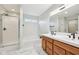 This bright bathroom features a double sink vanity, soaking tub, and separate shower at 8660 Benjamin Ln, Avon, IN 46123