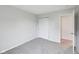 This room is carpeted with light gray walls and a closet at 8660 Benjamin Ln, Avon, IN 46123