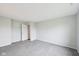 This room is carpeted with light gray walls and has a door to a closet at 8660 Benjamin Ln, Avon, IN 46123