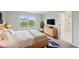 Comfortable bedroom with a large window and ensuite bathroom entrance at 8660 Benjamin Ln, Avon, IN 46123