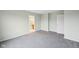 Spacious bedroom featuring soft neutral carpet, a large closet, and bathroom entrance at 8660 Benjamin Ln, Avon, IN 46123
