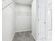 Walk-in closet with wire shelving and carpeted floors, providing ample storage space at 8660 Benjamin Ln, Avon, IN 46123