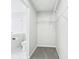 Walk-in closet featuring built-in shelves and carpeted floors at 8660 Benjamin Ln, Avon, IN 46123