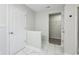 This hallway features tile floors and provides access to a bedroom and closet at 8660 Benjamin Ln, Avon, IN 46123