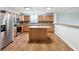 Modern kitchen features wood cabinets, stainless steel appliances, and a center island at 8660 Benjamin Ln, Avon, IN 46123