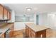 Spacious kitchen with a large granite island and an open view to the living area at 8660 Benjamin Ln, Avon, IN 46123