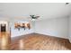 Bright living room with hardwood floors and a partial view of the eat-in kitchen at 8660 Benjamin Ln, Avon, IN 46123