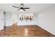 Open-concept living space with hardwood floors and a bar that connects to the kitchen at 8660 Benjamin Ln, Avon, IN 46123