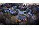 Aerial view of a neighborhood with a lake in the background and a lush, green landscape at 8939 Spider Bay Ct, Indianapolis, IN 46236