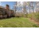 A spacious backyard features a well-maintained lawn and mature trees, offering a serene outdoor space at 8939 Spider Bay Ct, Indianapolis, IN 46236
